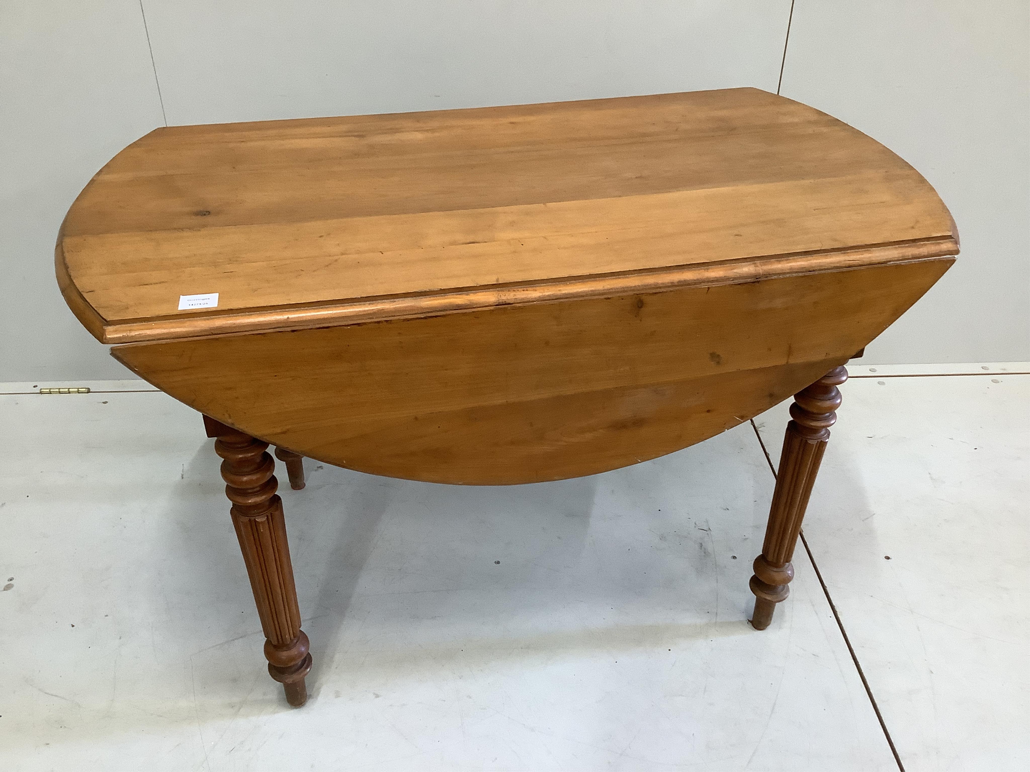 A 19th century French pine drop leaf kitchen table, width 118cm, depth 66cm, height 72cm